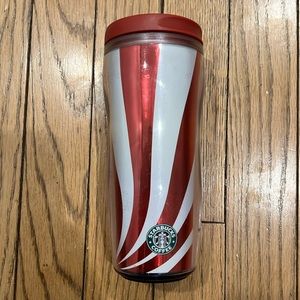 Red and white Starbucks travel mug
